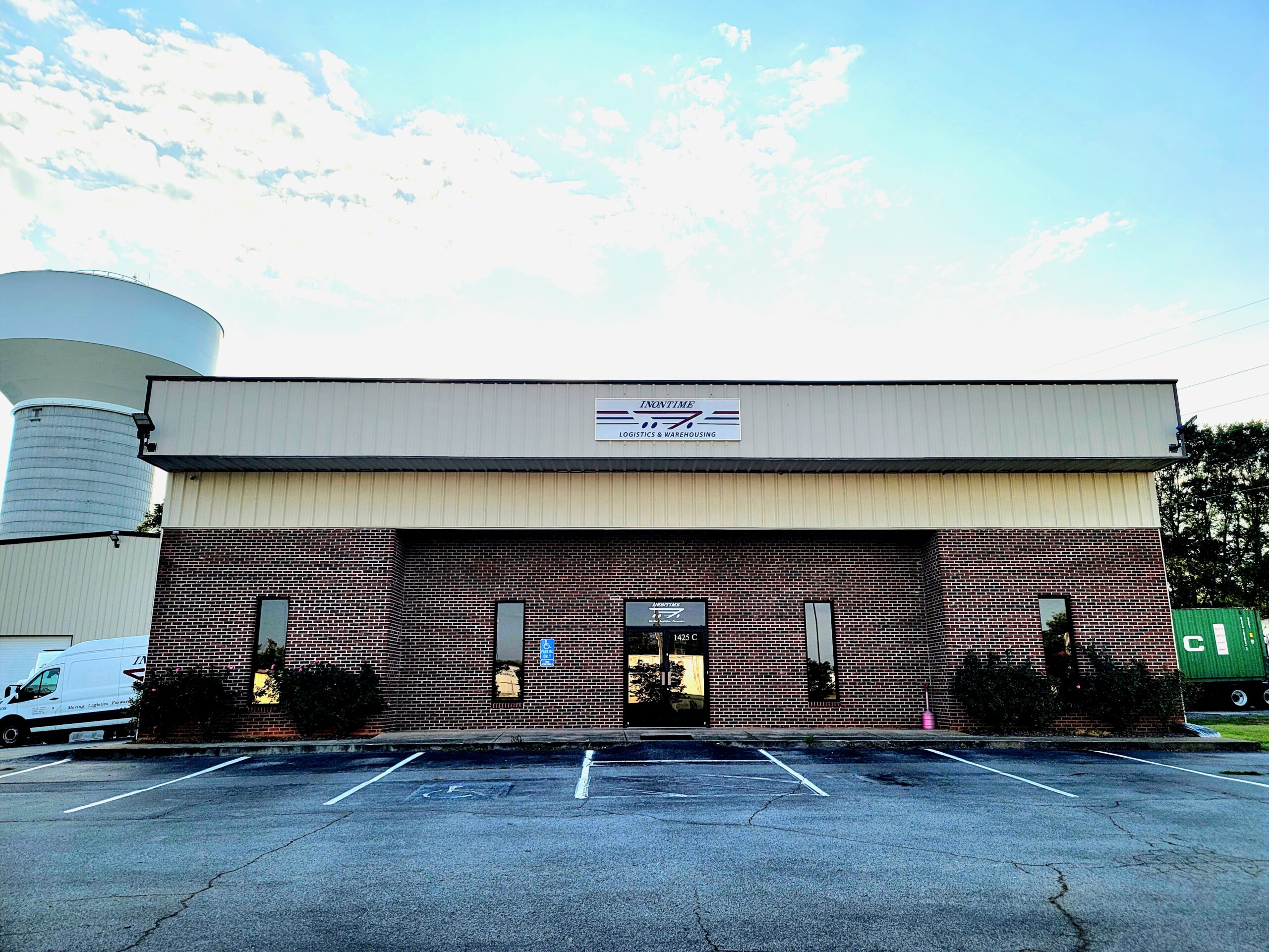 20230824_185750 Exterior view of Inontime’s Greer, South Carolina office with brick facade and company signage.